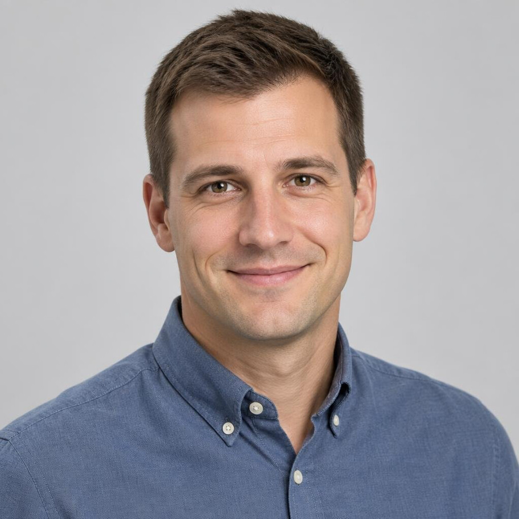 Studio portrait of a Croatian man with short hair wearing a casual shirt