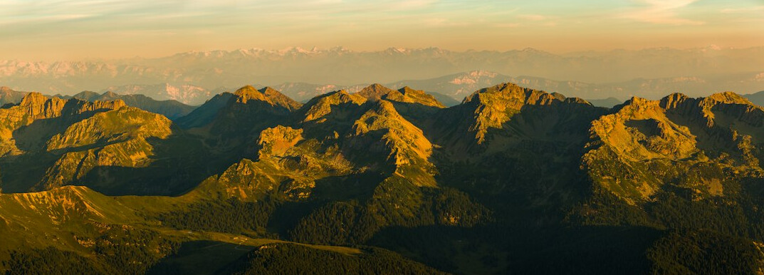 Aerial view of a mountain range at golden sunset