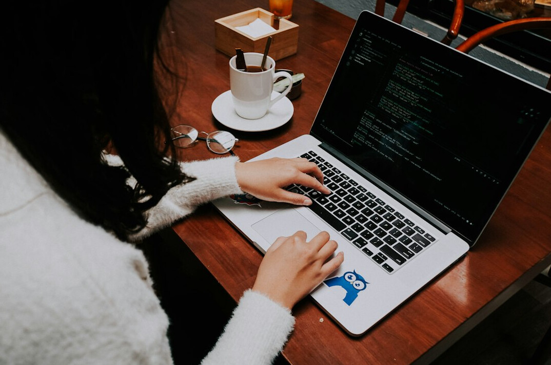 person learning python on laptop
