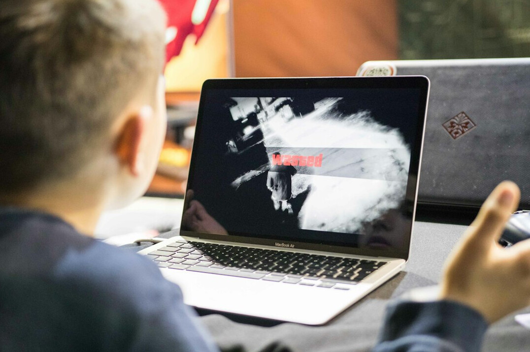student learning coding on laptop